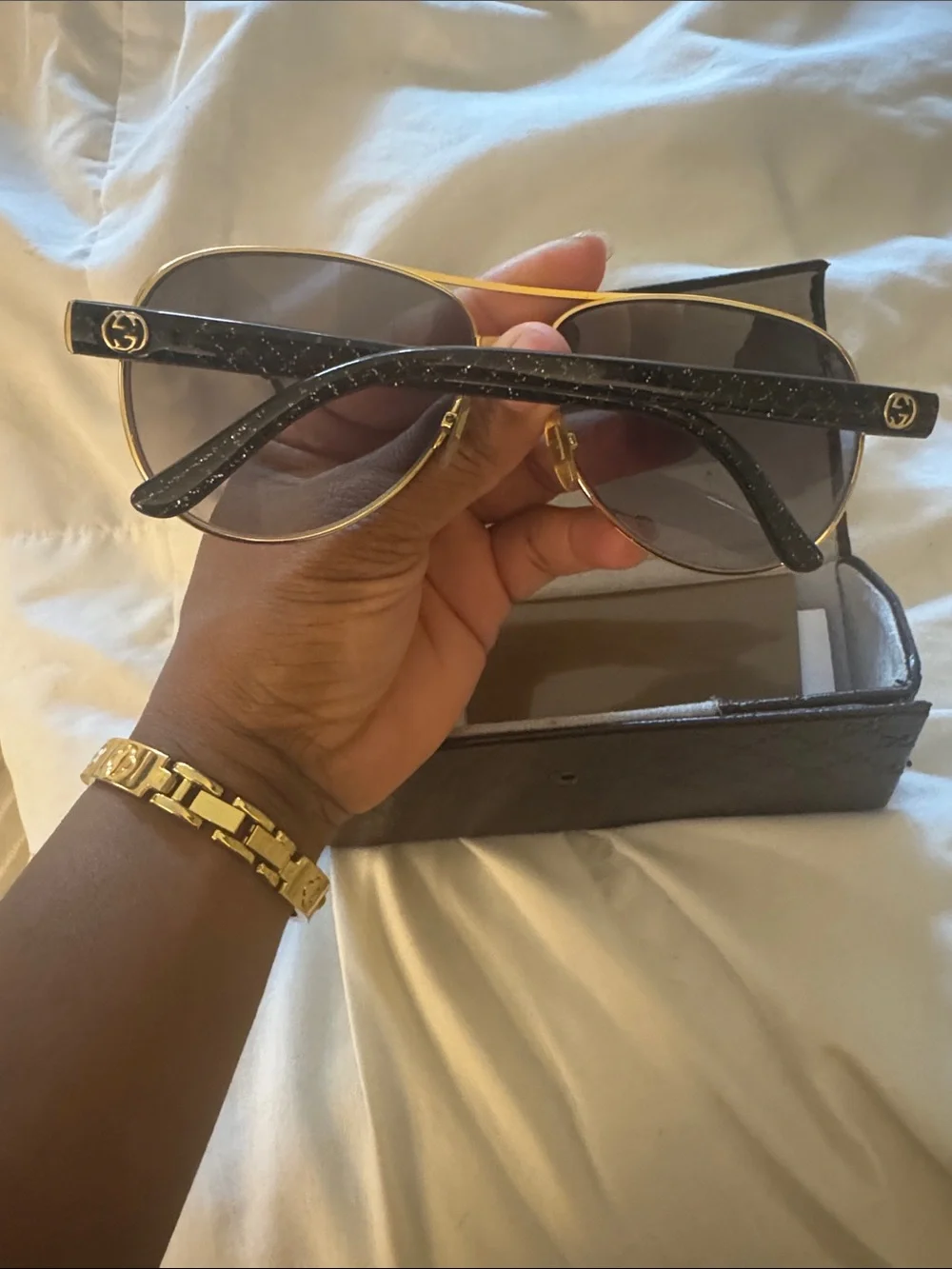 Gucci Black Frame Sunglasses with Gold Brow Bar
